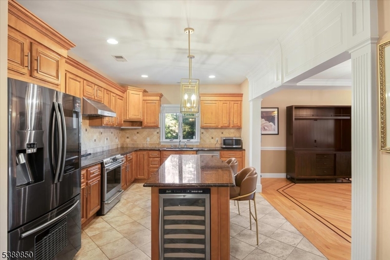 68 Horseneck Road Montville, NJ 07045 - Photo 10 of 34 a kitchen with stainless steel appliances granite countertop a refrigerator and a stove top oven