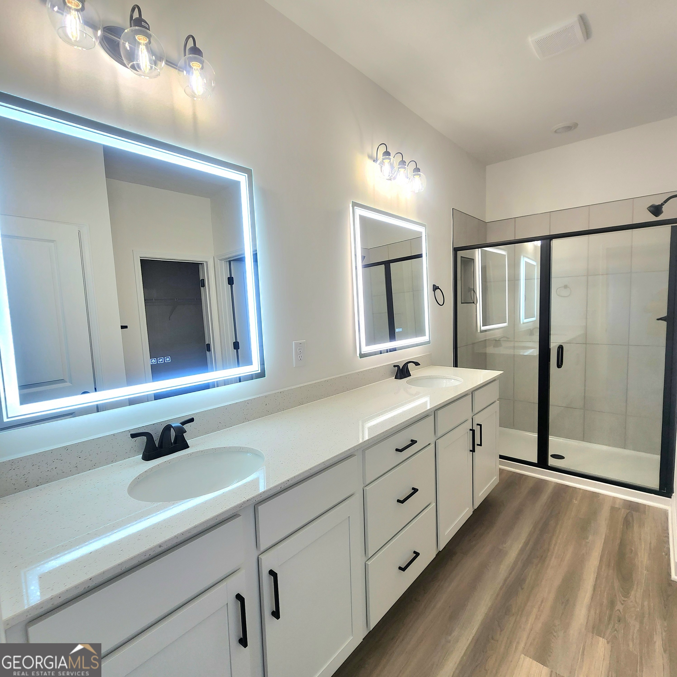 431 North Unity Grove Road Locust Grove, GA 30248 - Photo 11 of 18 a bathroom with double vanity sink and a mirror