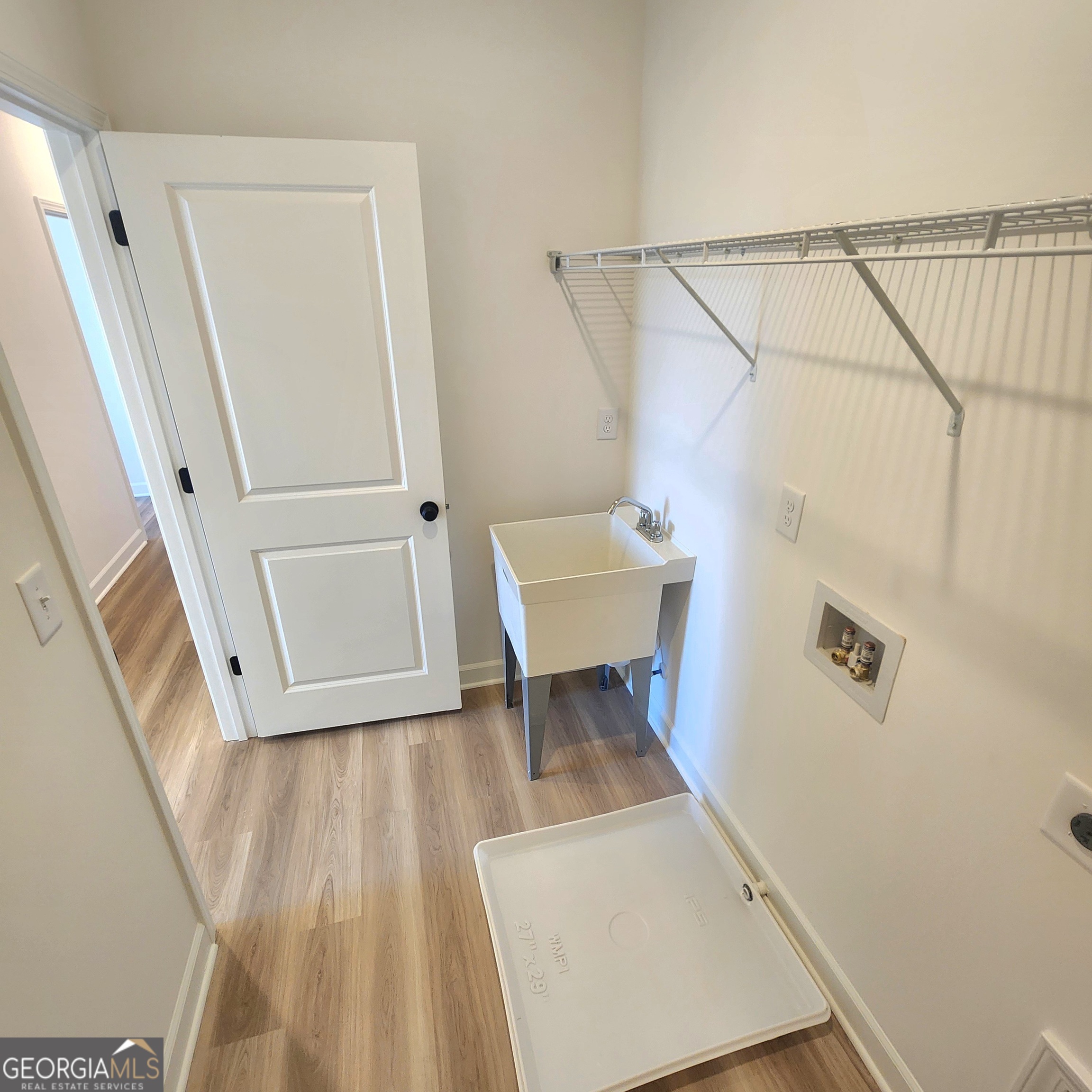 431 North Unity Grove Road Locust Grove, GA 30248 - Photo 12 of 18 a view of a bedroom with wooden floor and bench