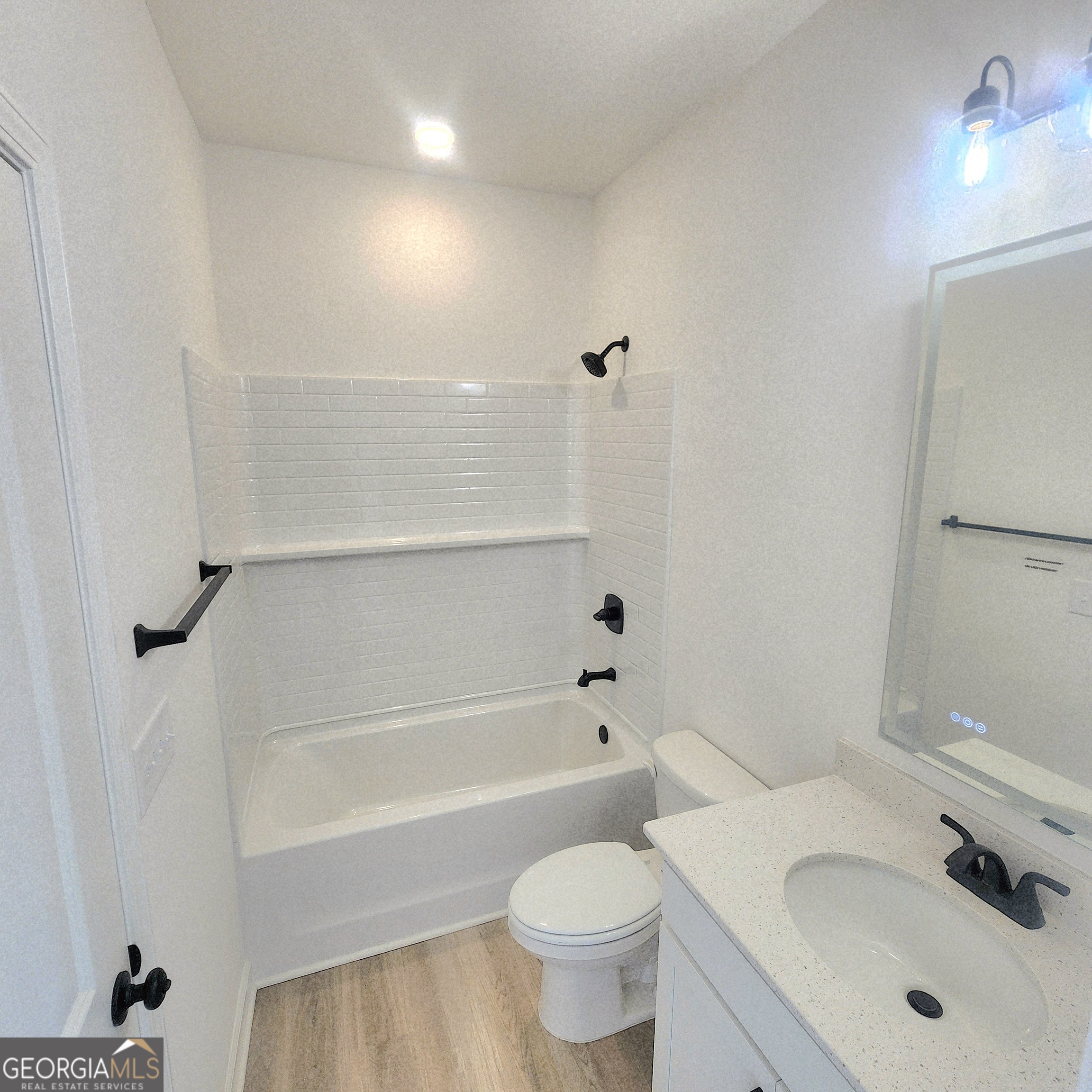 431 North Unity Grove Road Locust Grove, GA 30248 - Photo 14 of 18 a bathroom with a sink toilet and shower