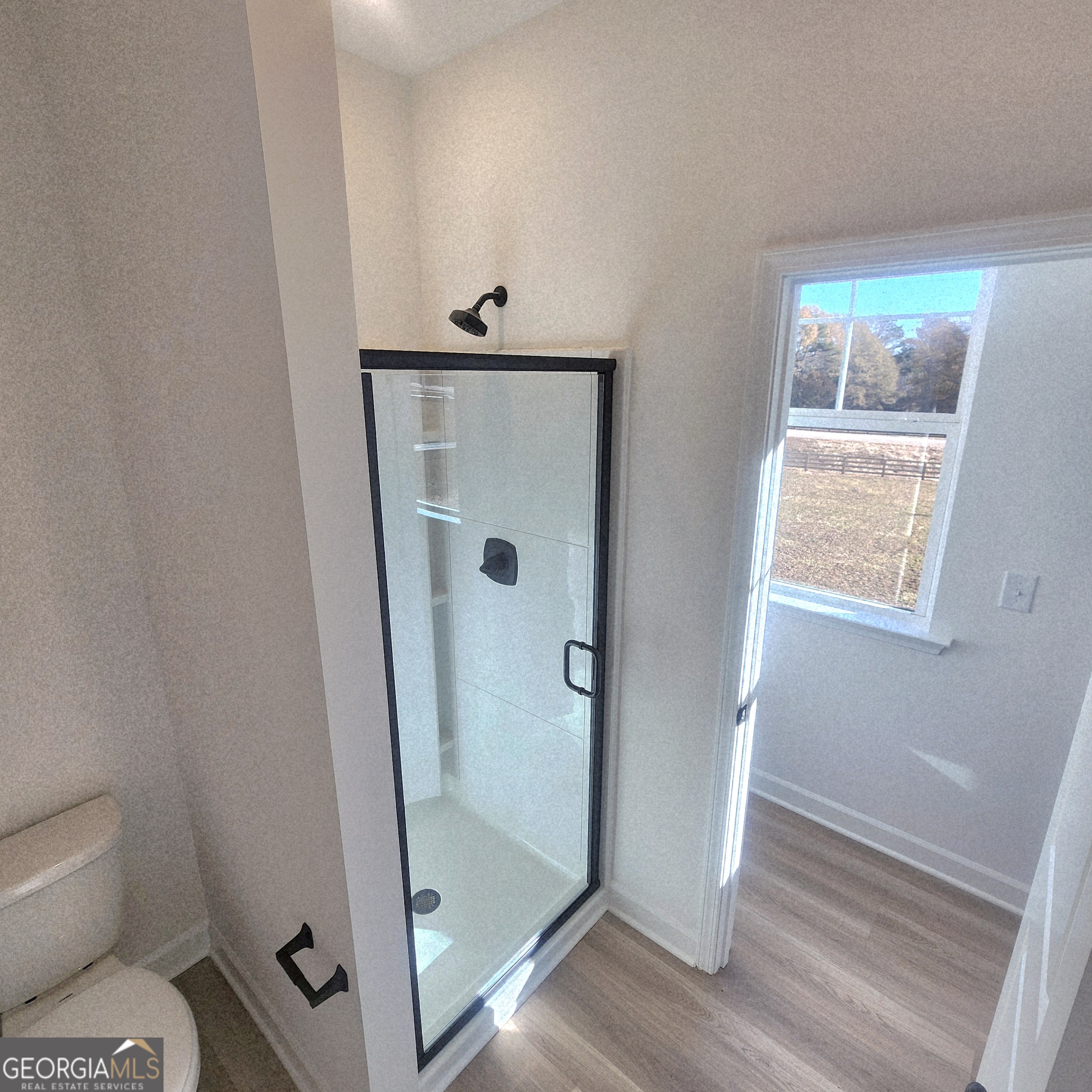 431 North Unity Grove Road Locust Grove, GA 30248 - Photo 18 of 18 a bathroom with a toilet and a shower
