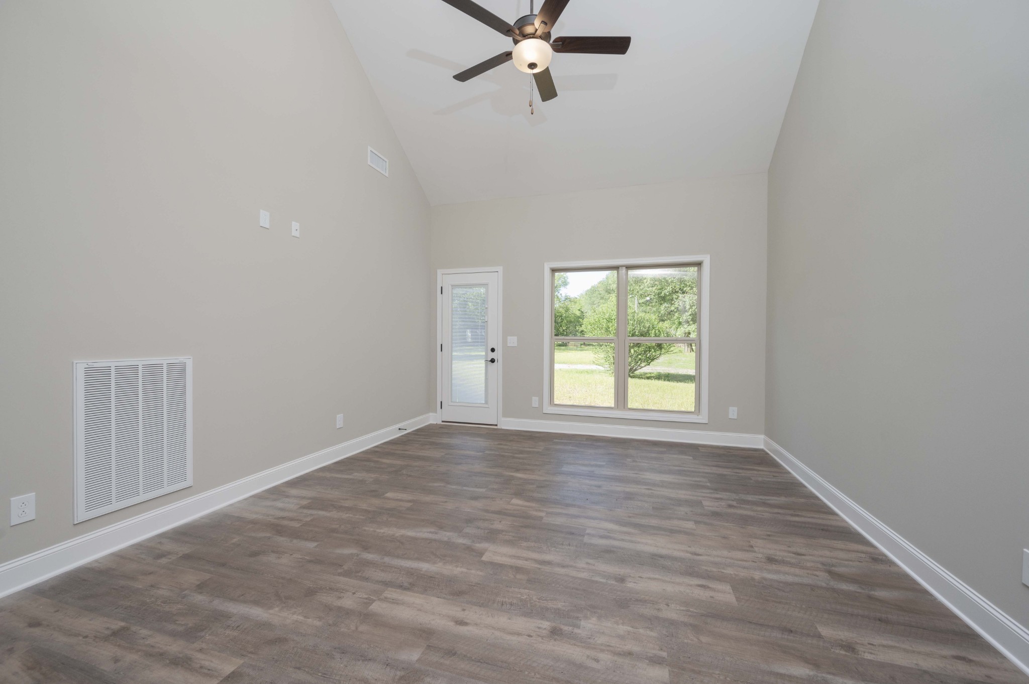 283 Providence Road Pelham, TN 37366 - Photo 11 of 24 an empty room with a window and a fan