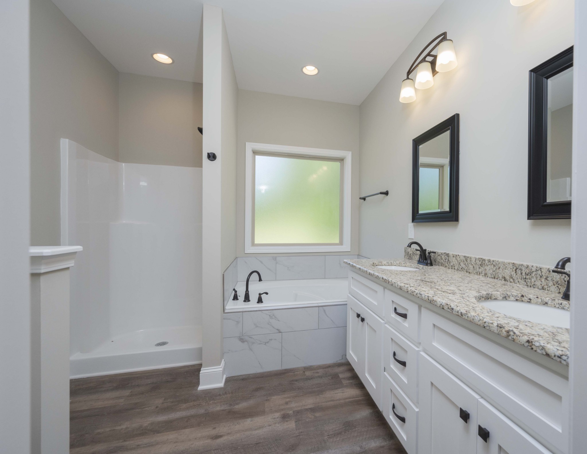 283 Providence Road Pelham, TN 37366 - Photo 16 of 24 a bathroom with a tub a sink and mirror