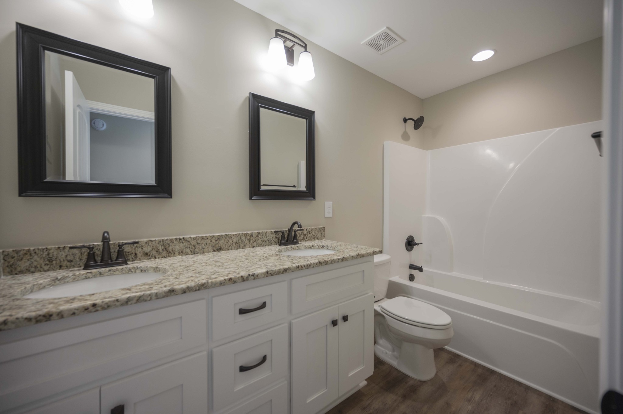 283 Providence Road Pelham, TN 37366 - Photo 19 of 24 a bathroom with a granite countertop toilet sink and mirror