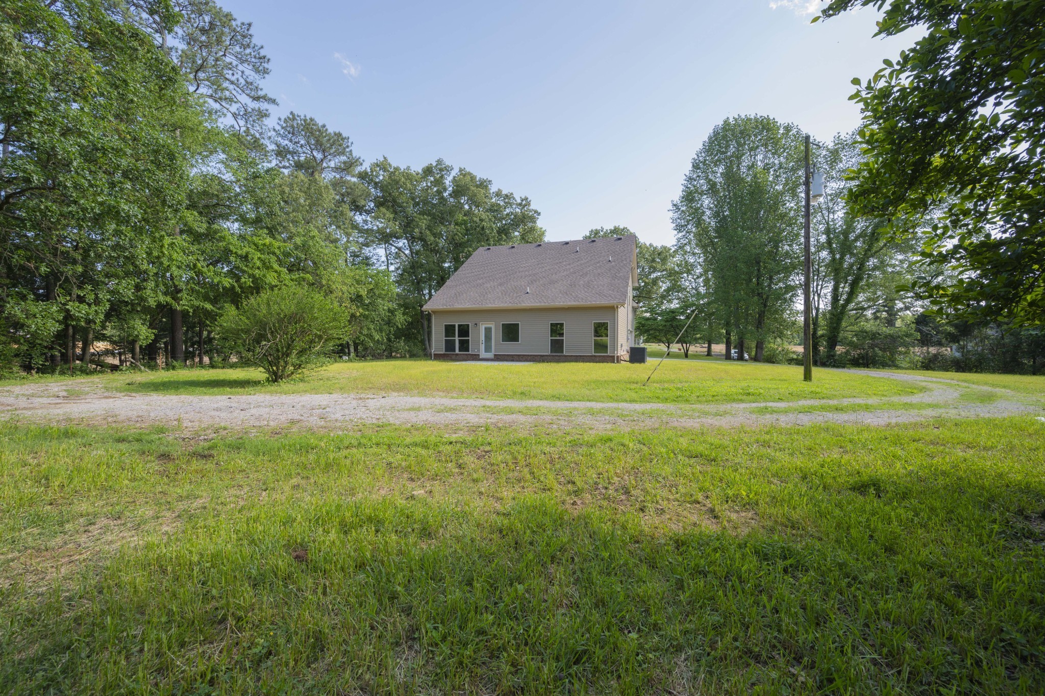 283 Providence Road Pelham, TN 37366 - Photo 22 of 24 a front view of a house with a yard