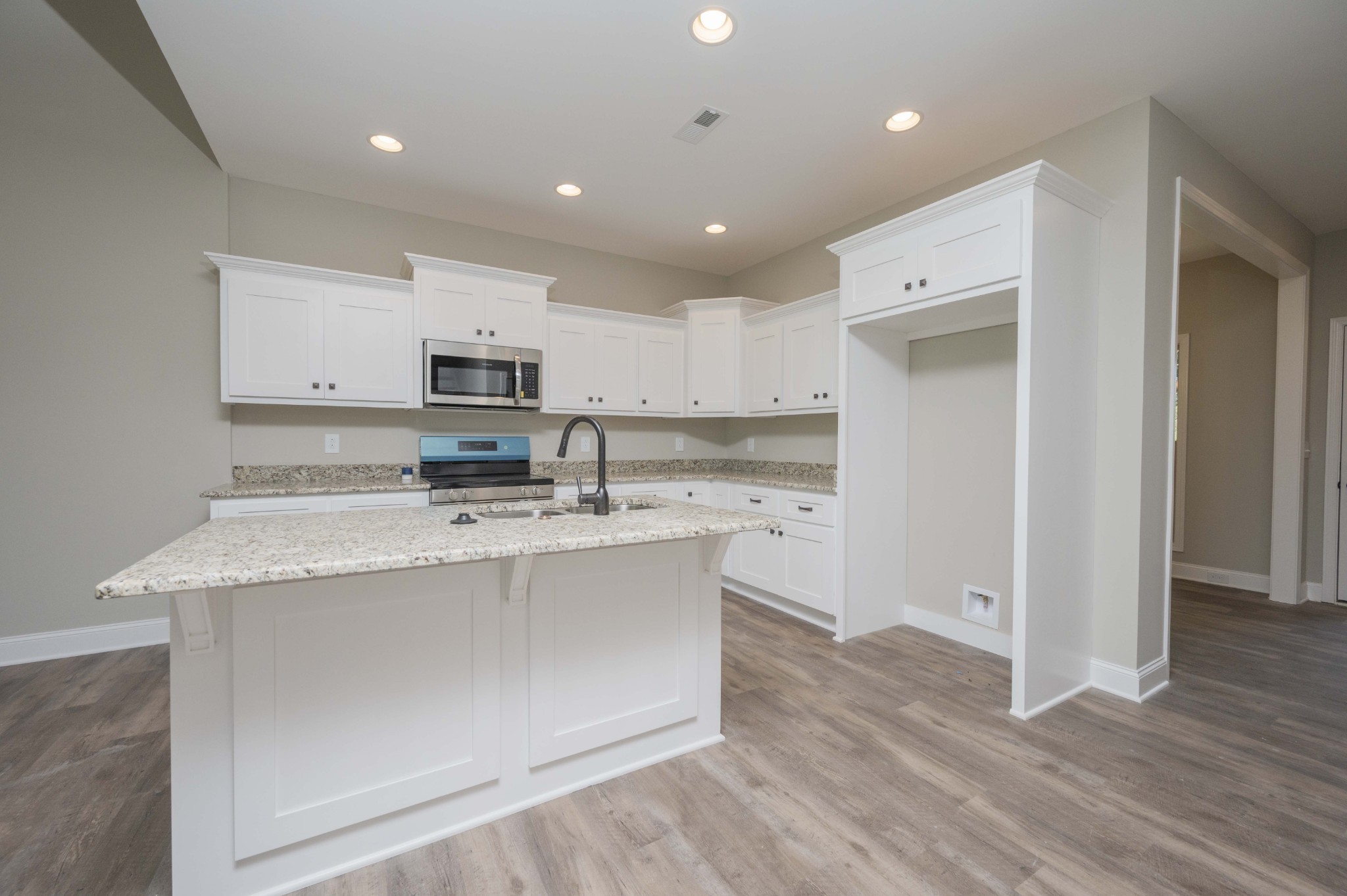 283 Providence Road Pelham, TN 37366 - Photo 6 of 24 a large kitchen with stainless steel appliances granite countertop a stove a sink and a refrigerator