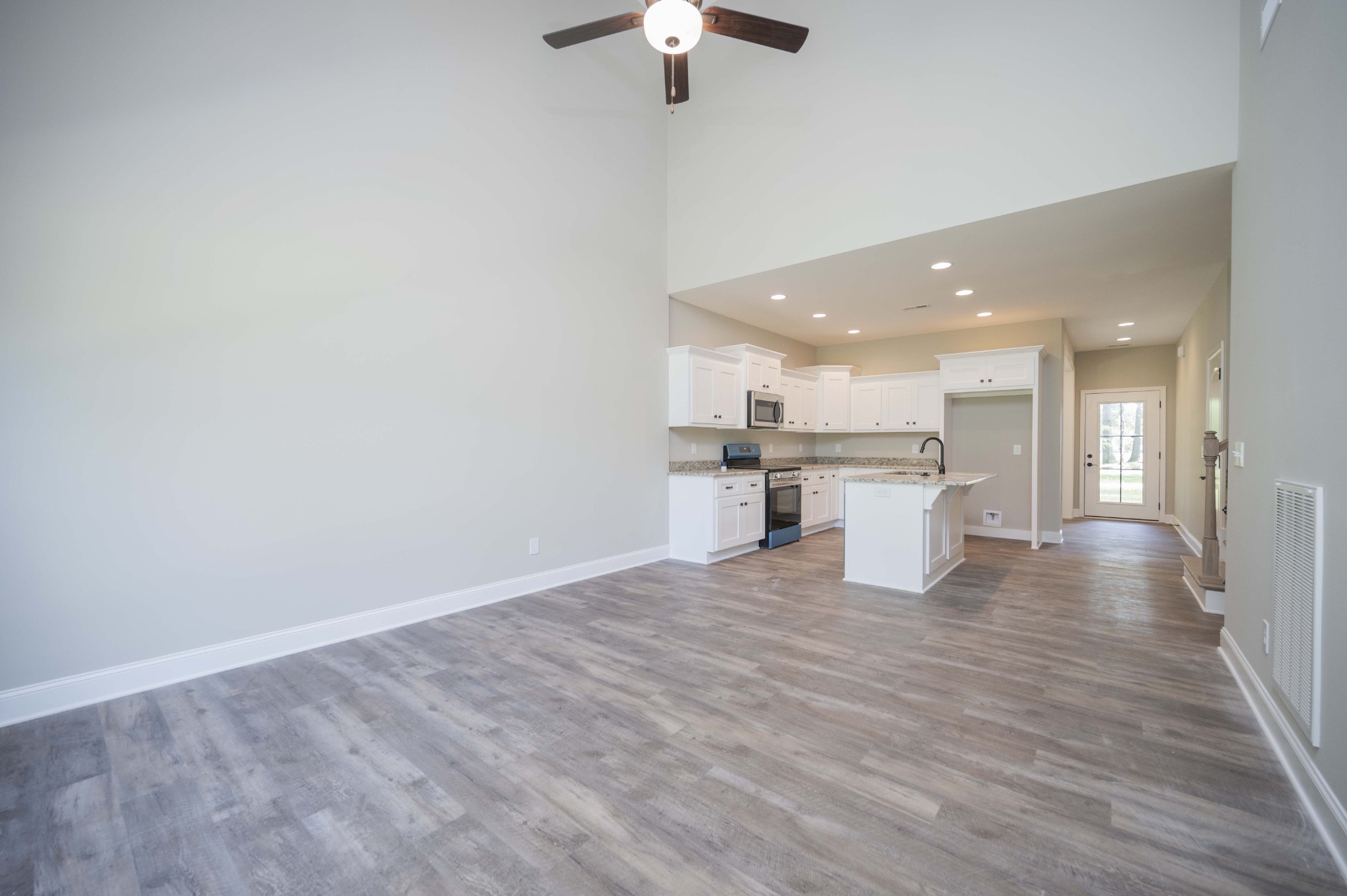 283 Providence Road Pelham, TN 37366 - Photo 8 of 24 a view of kitchen with a sink wooden cabinets and a refrigerator