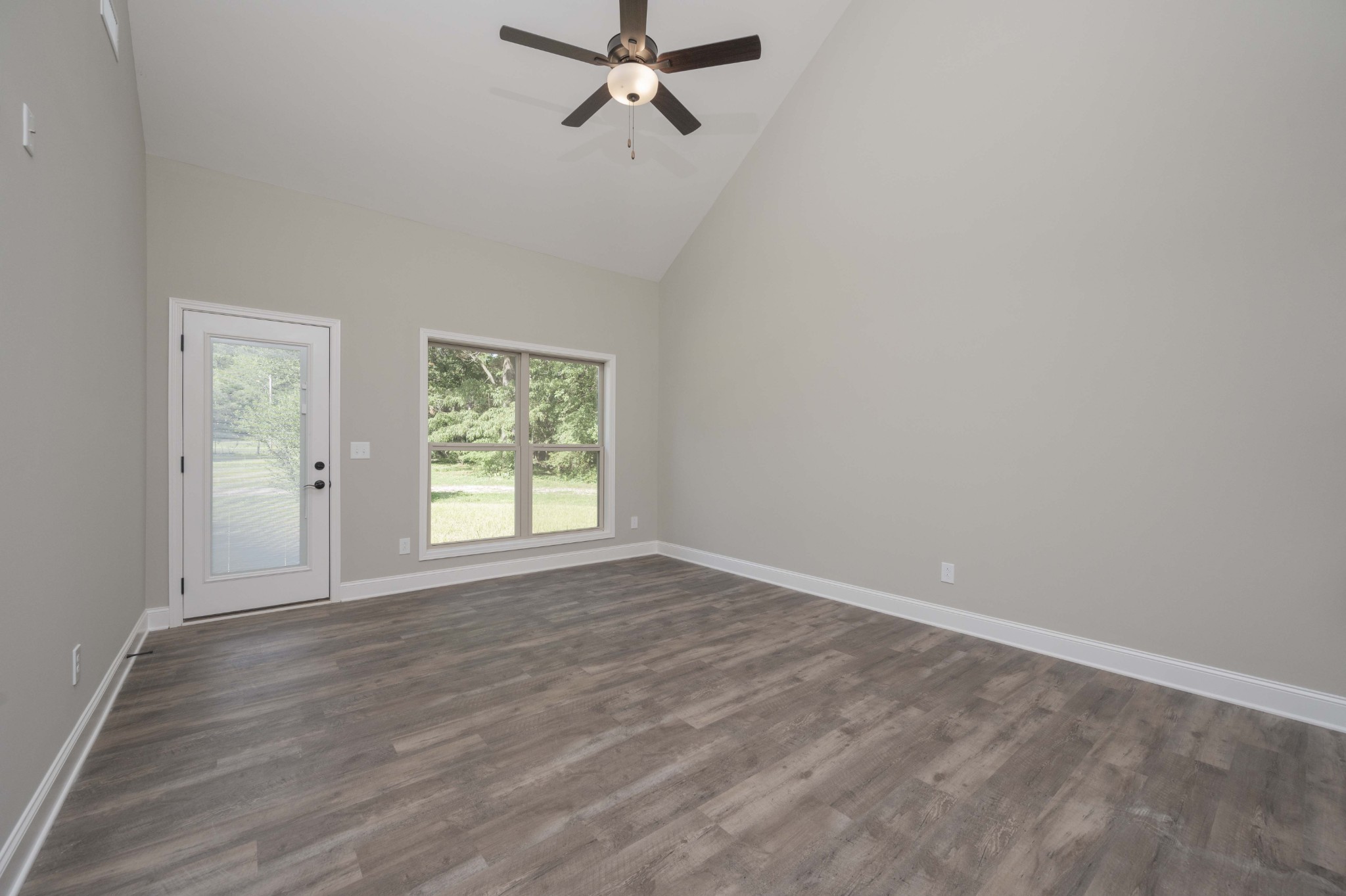 283 Providence Road Pelham, TN 37366 - Photo 10 of 24 wooden floor in an empty room with a window