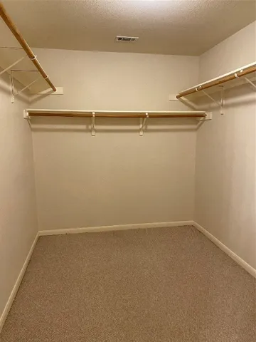 a view of an empty walk in closet