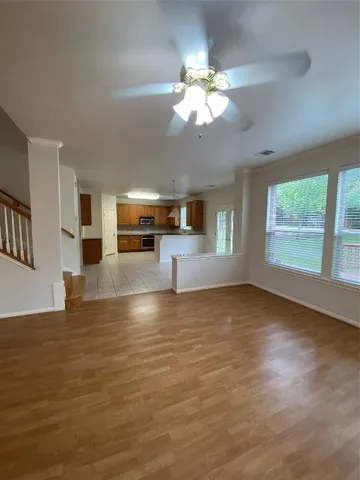 a view of a livingroom with a kitchen island in the center