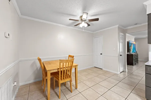a view of an empty room and wooden floor