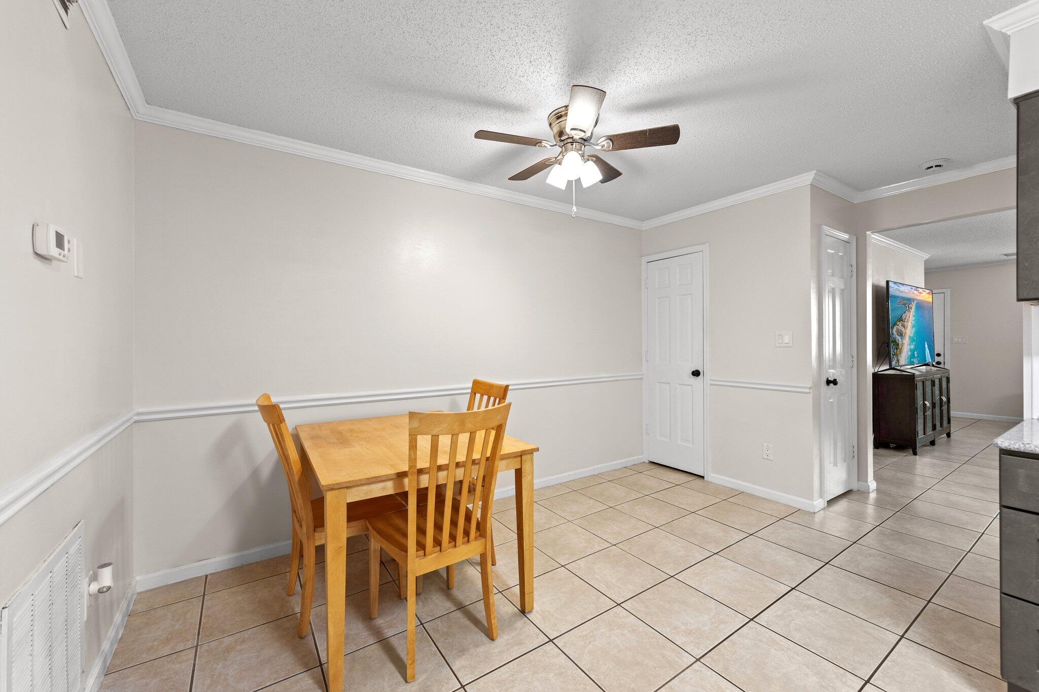 114 4th Avenue Shalimar, FL 32579 - Photo 13 of 59 a view of an empty room and wooden floor