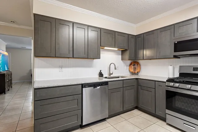 a kitchen with a sink and cabinets