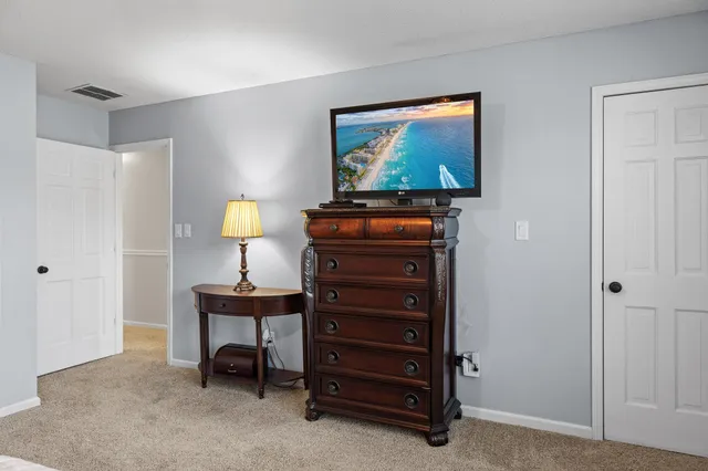 a bathroom with a toilet a sink and shower