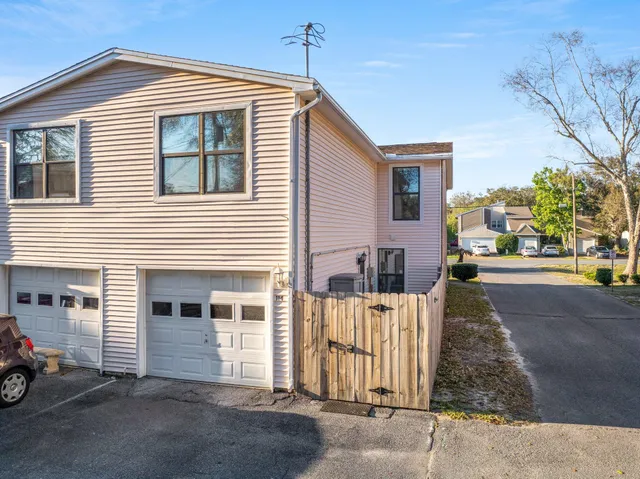 a front view of a house with a garage
