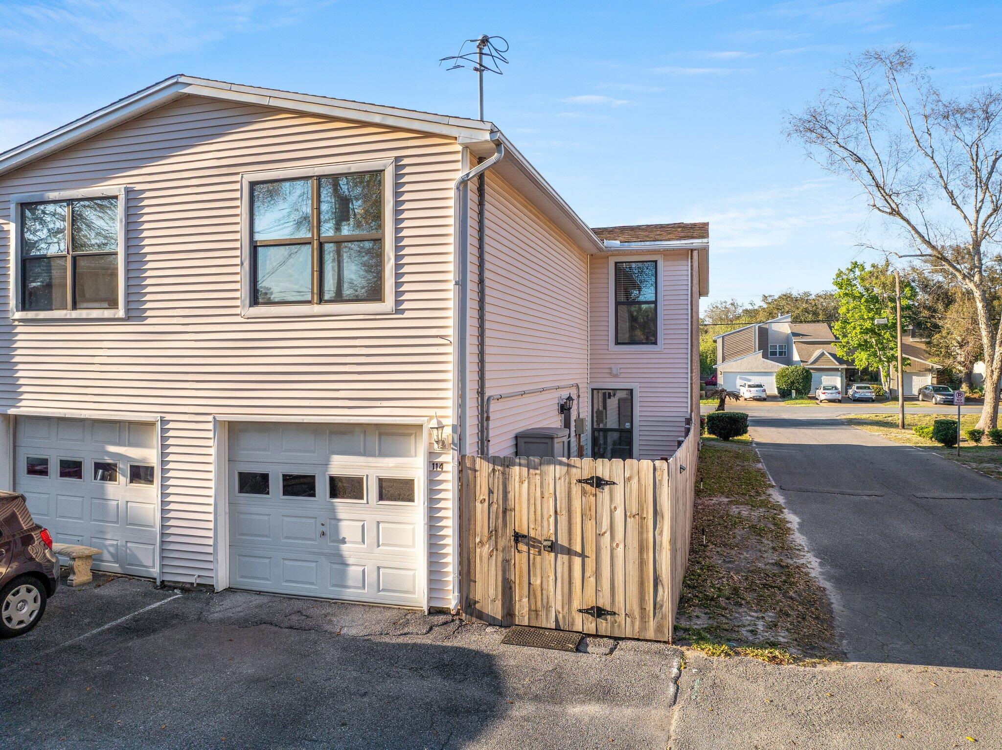 114 4th Avenue Shalimar, FL 32579 - Photo 3 of 59 a front view of a house with a garage