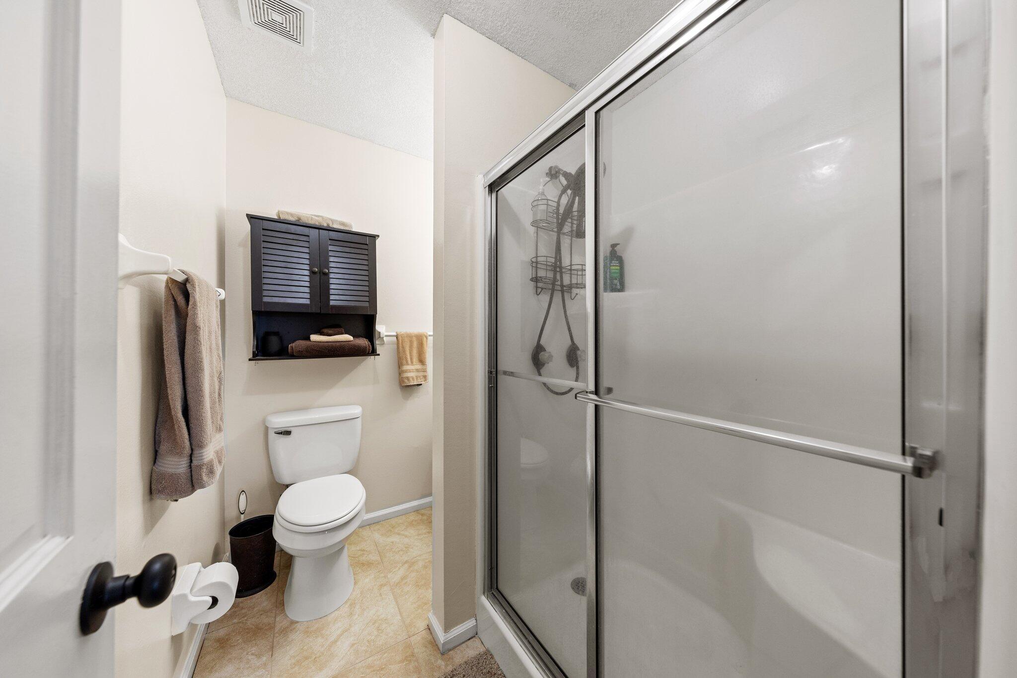 114 4th Avenue Shalimar, FL 32579 - Photo 32 of 59 a bathroom with a toilet a sink and shower