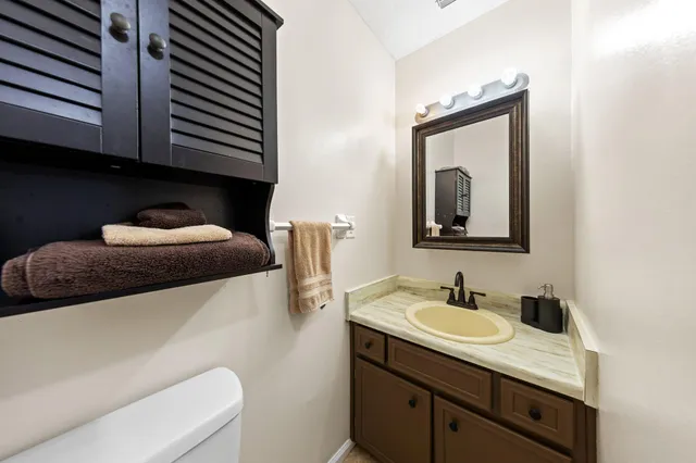 a room with mirror and furniture