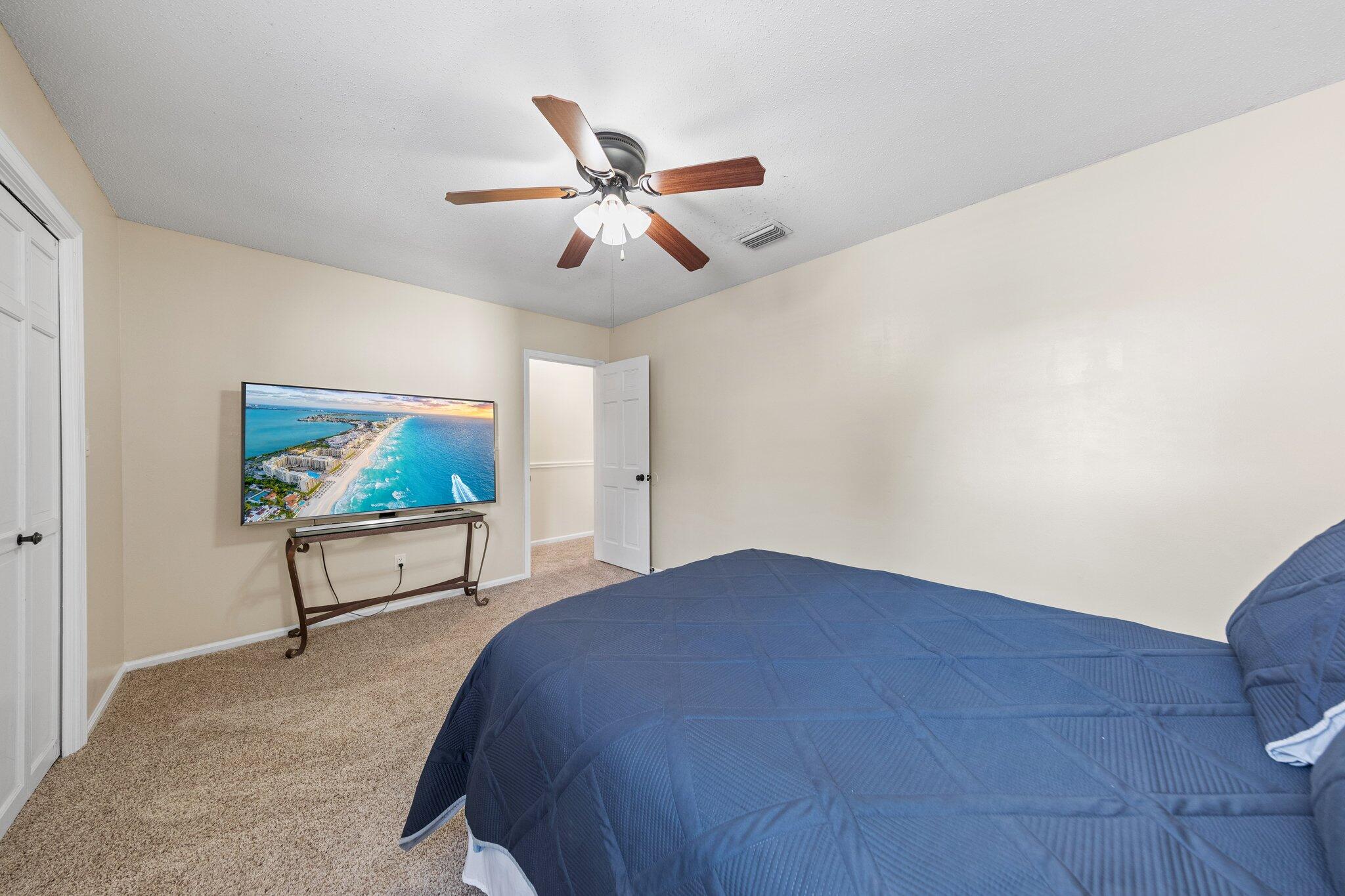 114 4th Avenue Shalimar, FL 32579 - Photo 37 of 59 a bedroom with a bed and a painting on the wall
