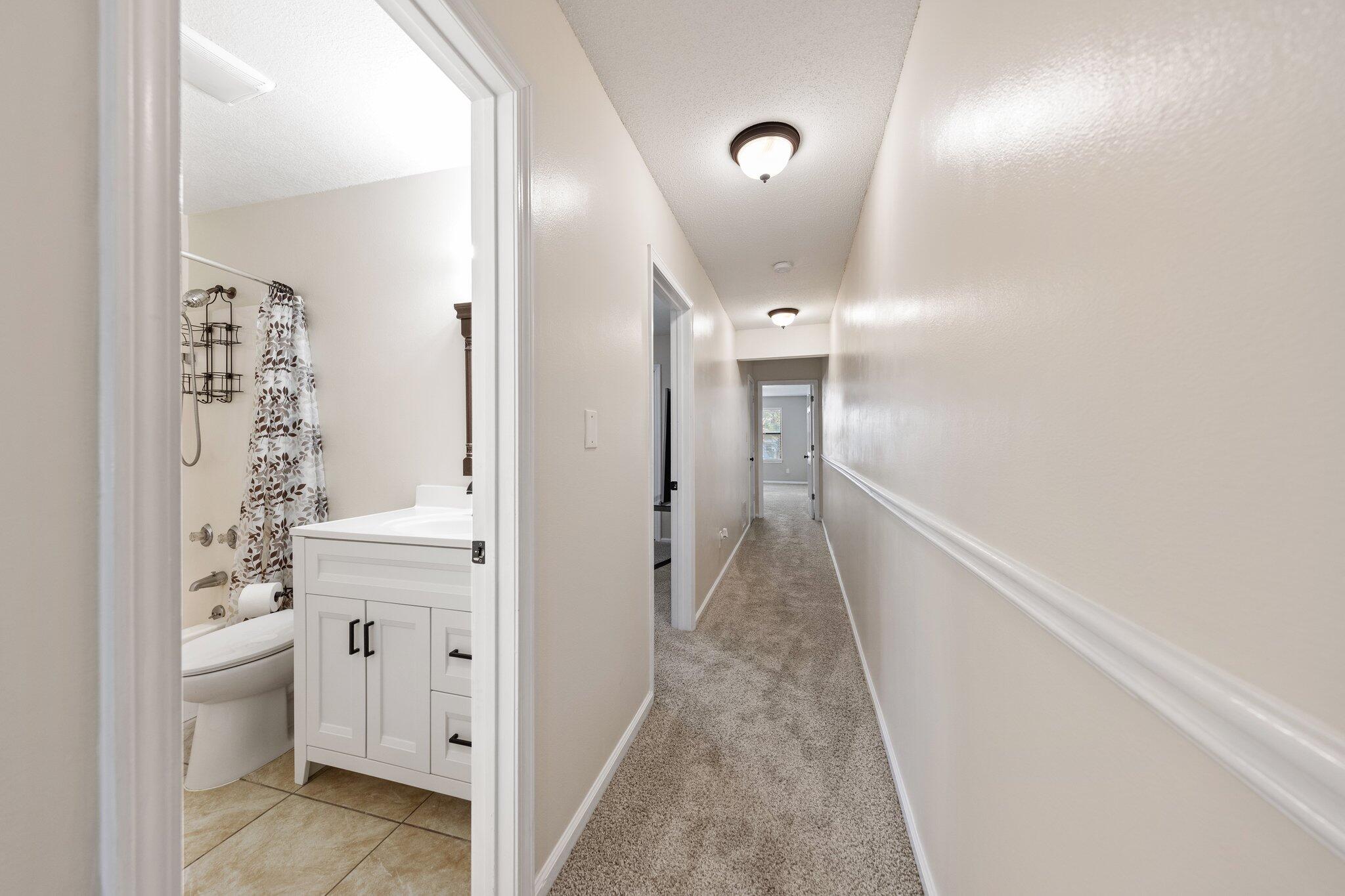 114 4th Avenue Shalimar, FL 32579 - Photo 43 of 59 a view of a hallway with bathroom and shower