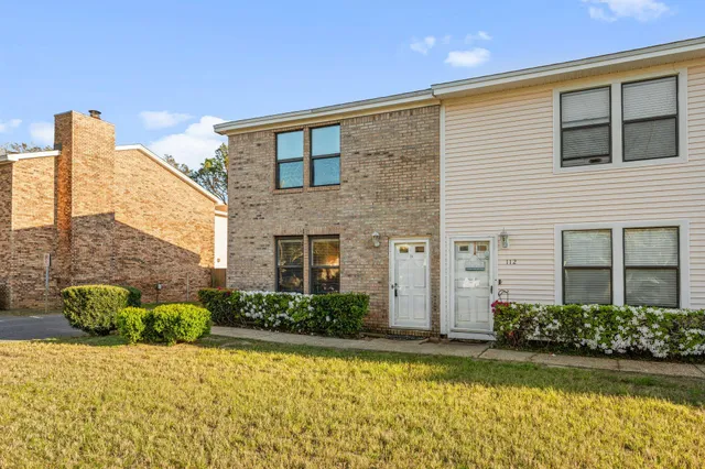 a front view of a house with parking space