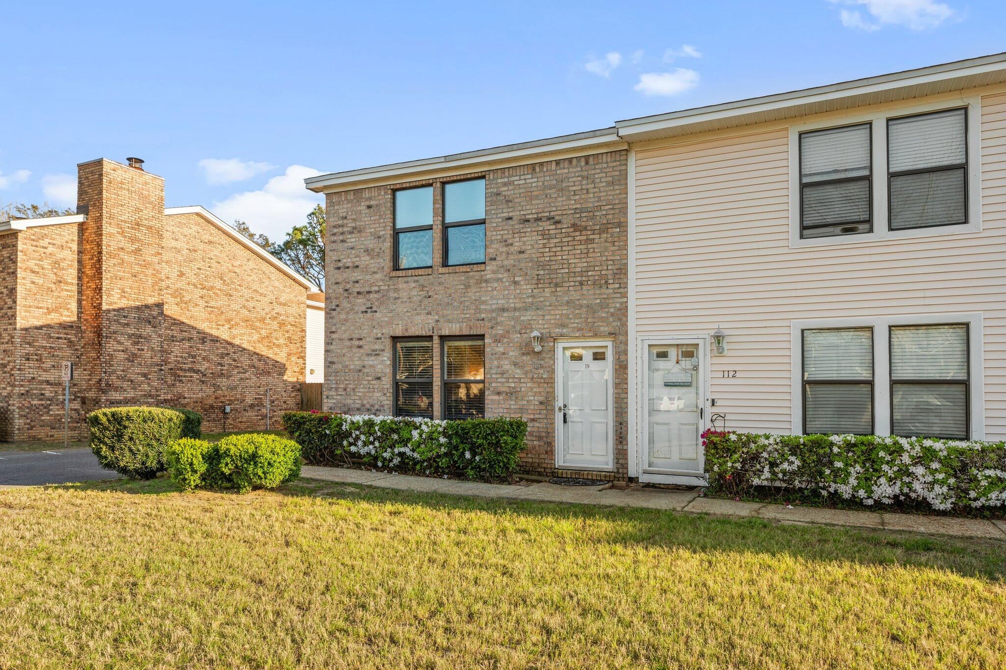 114 4th Avenue Shalimar, FL 32579 - Photo 45 of 59 a front view of a house with a garden
