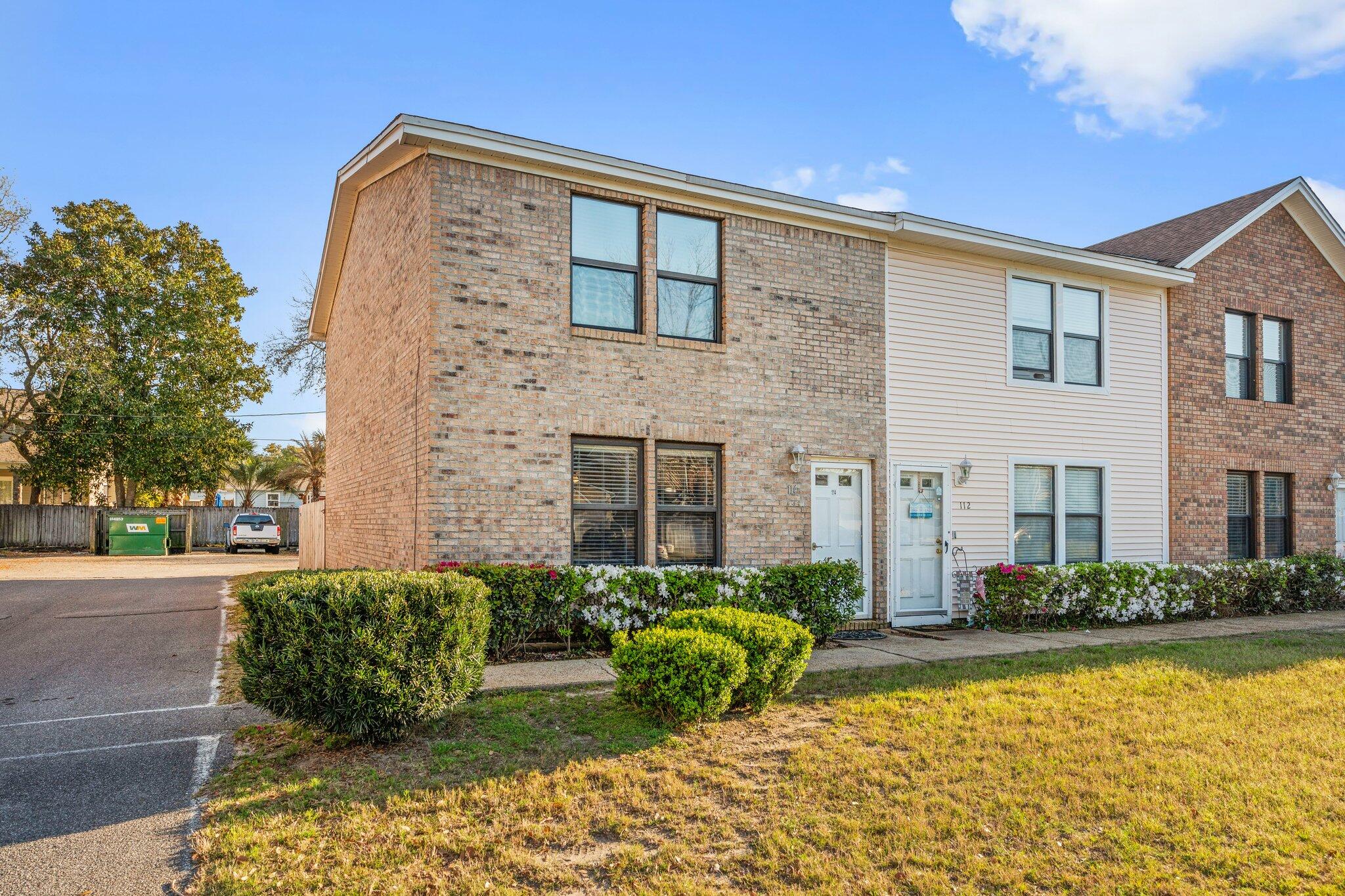 114 4th Avenue Shalimar, FL 32579 - Photo 46 of 59 a front view of a house with swimming pool having outdoor seating