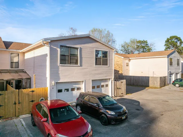 an aerial view of residential building and car parked