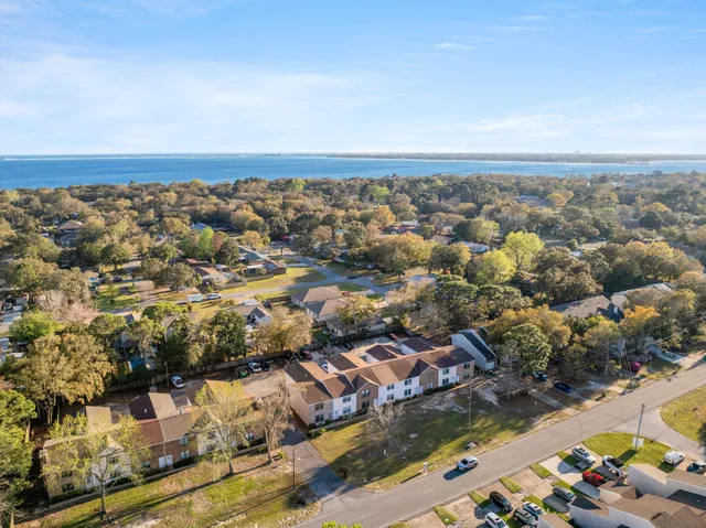 an aerial view of residential houses with outdoor space