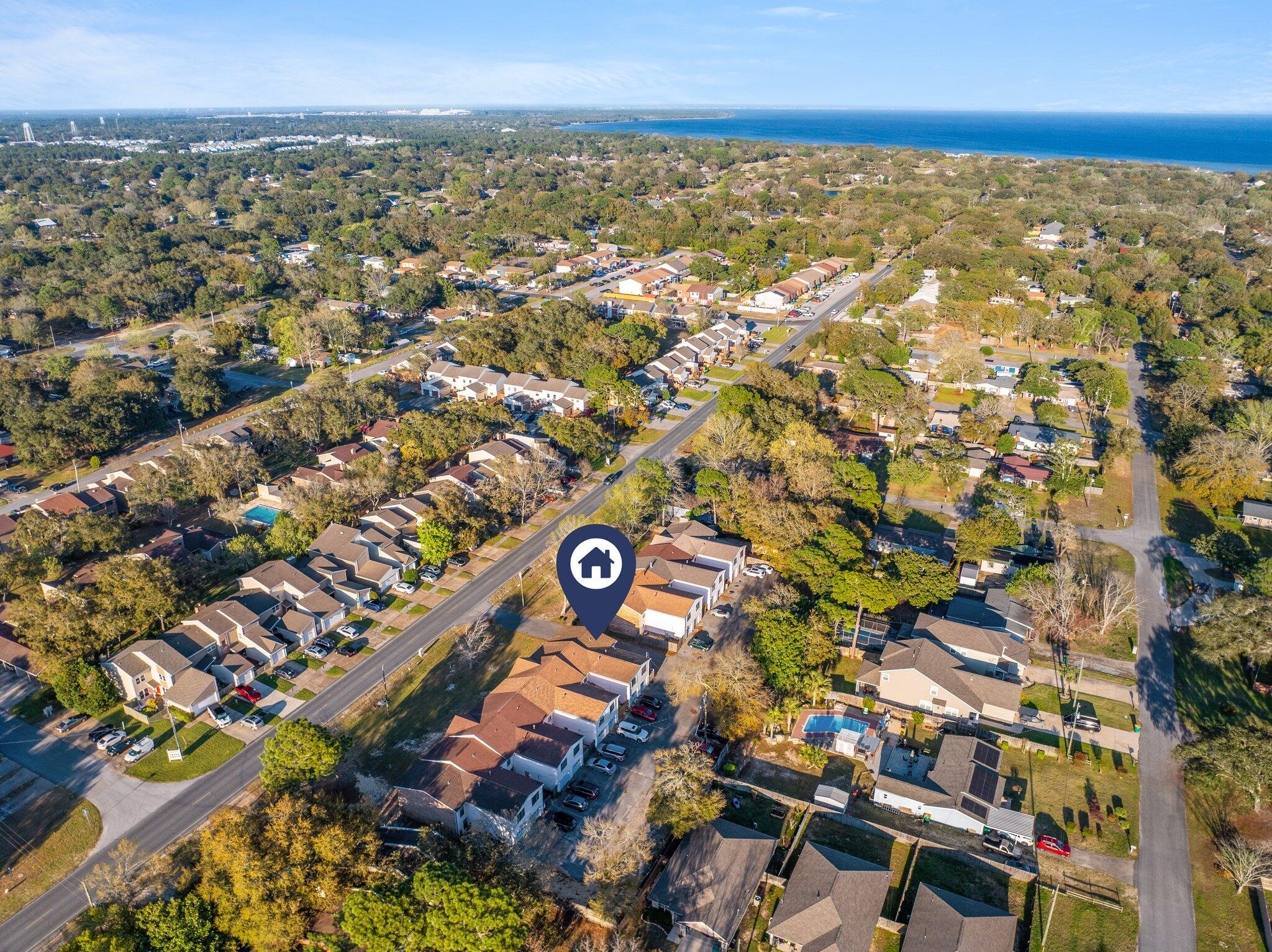 114 4th Avenue Shalimar, FL 32579 - Photo 57 of 59 an aerial view of residential building and parking space