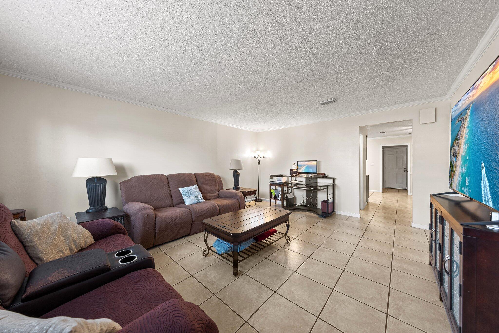 114 4th Avenue Shalimar, FL 32579 - Photo 7 of 59 a living room with furniture and a wooden floor