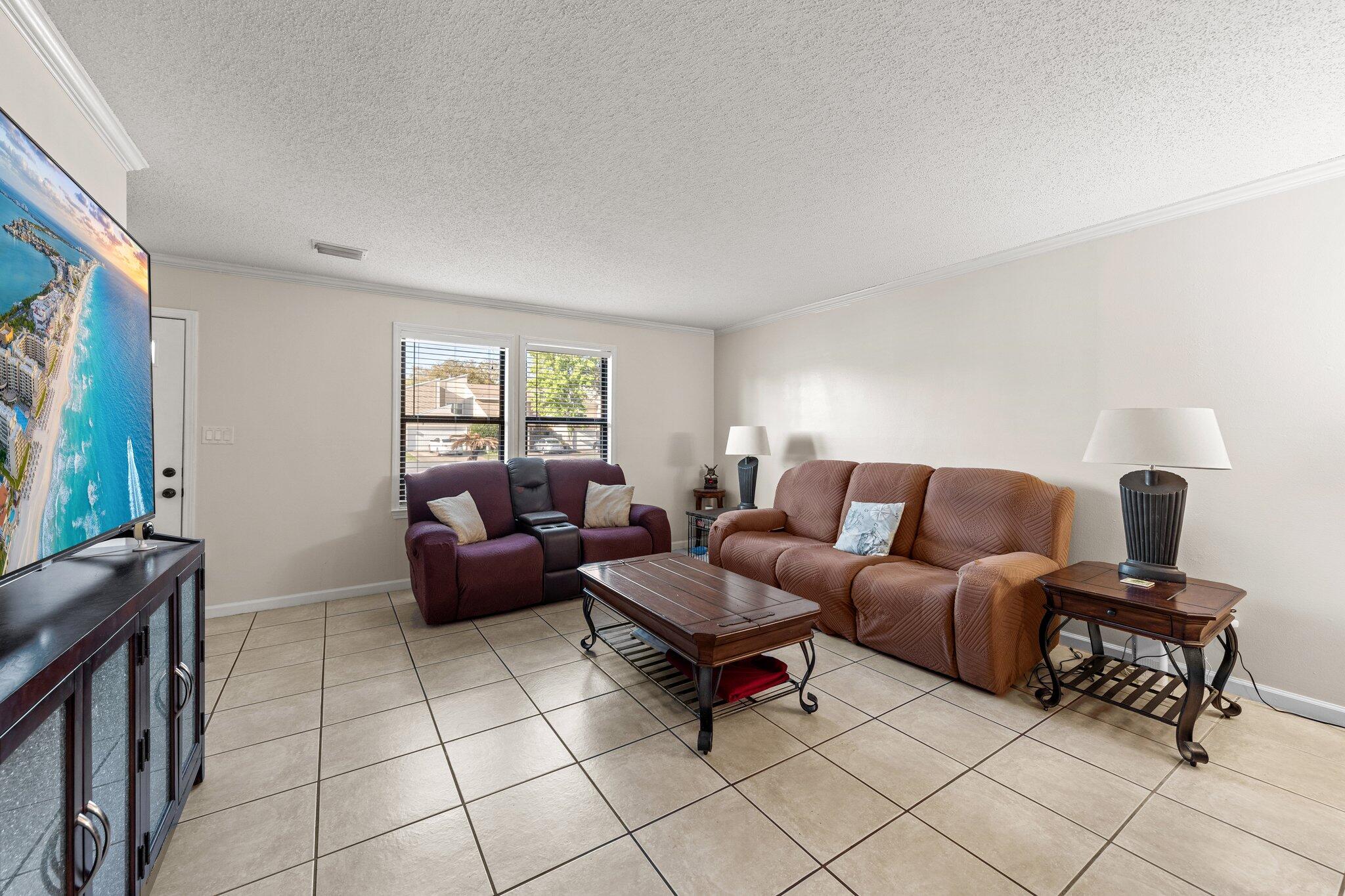 114 4th Avenue Shalimar, FL 32579 - Photo 8 of 59 a living room with furniture and a window