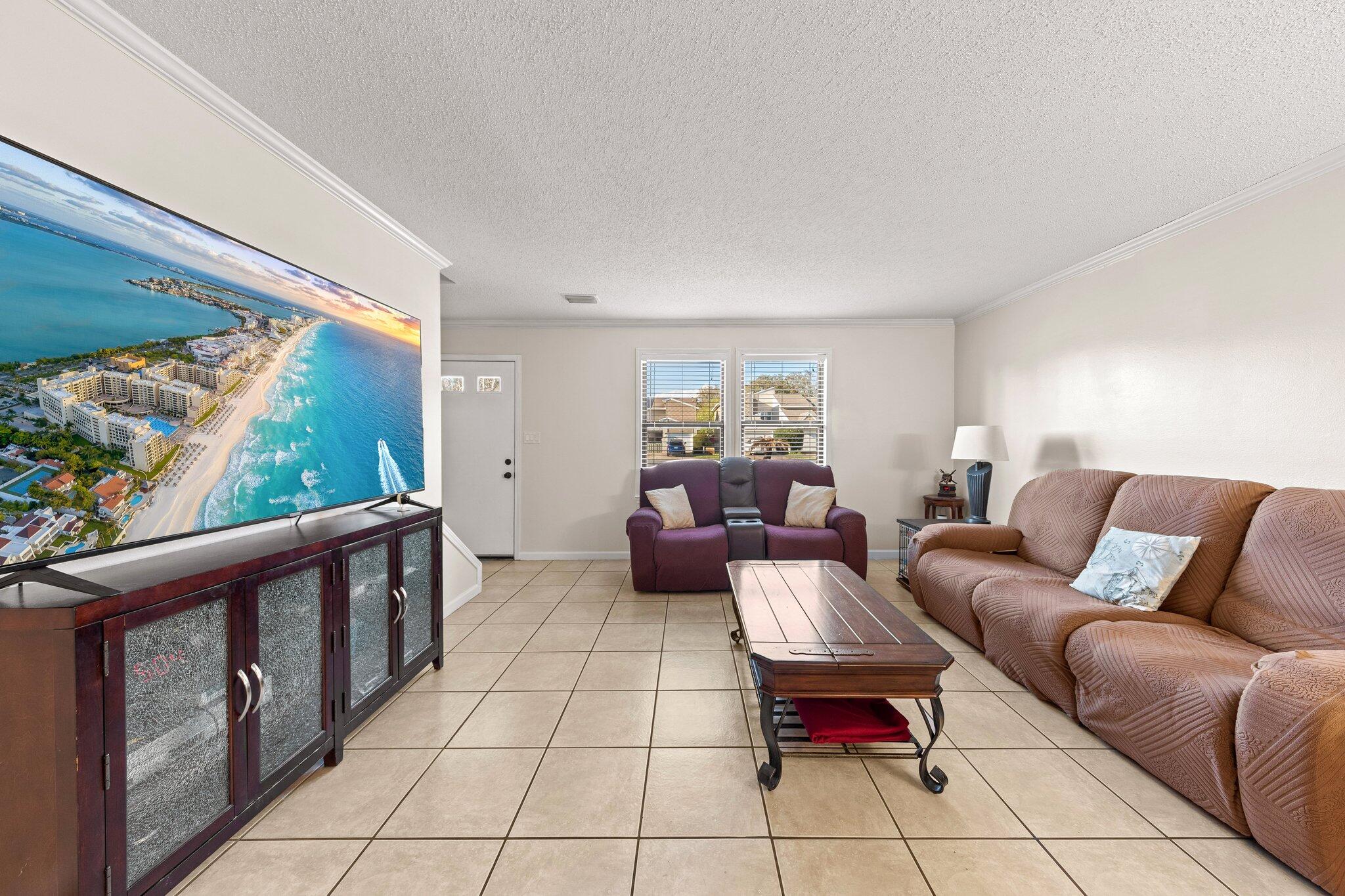 114 4th Avenue Shalimar, FL 32579 - Photo 10 of 59 a living room with furniture and a large window