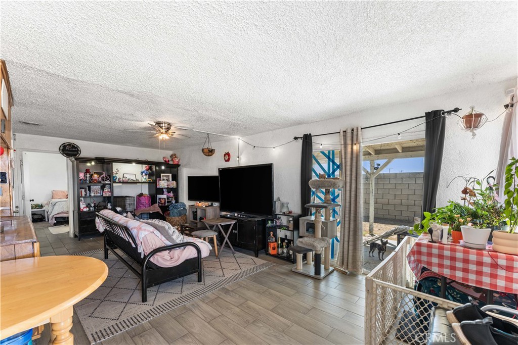 20116 Neuralia Road California City, CA 93505 - Photo 5 of 25 a living room with furniture and a flat screen tv