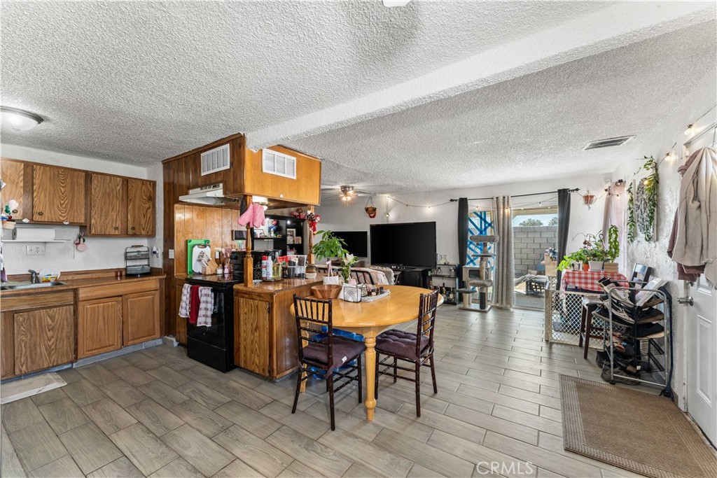 20116 Neuralia Road California City, CA 93505 - Photo 9 of 25 a view of a dining room with furniture window and outside view