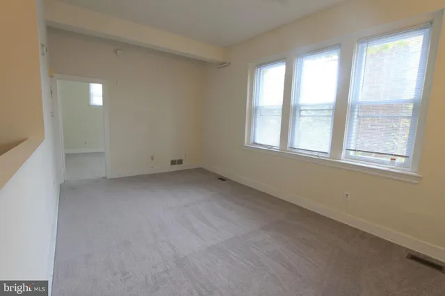 an empty room with windows