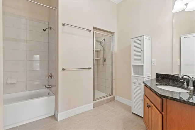 a bathroom with a bathtub and a shower