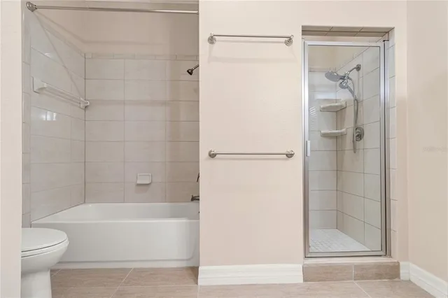 a view of entryway with wooden floor and front door