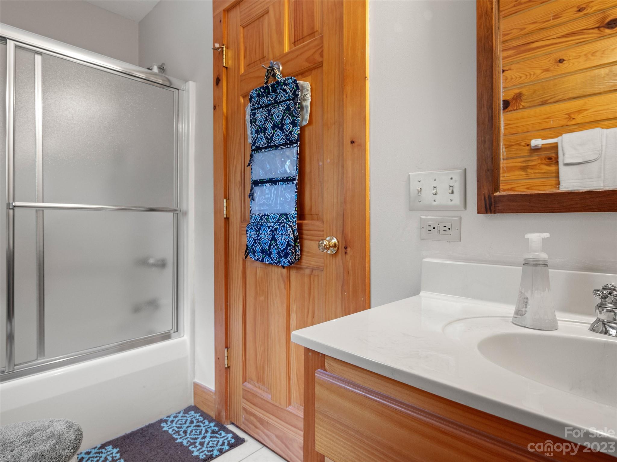201 Staton Ridge Road Saluda, NC 28773 - Photo 23 of 32 a bathroom with a sink and a mirror