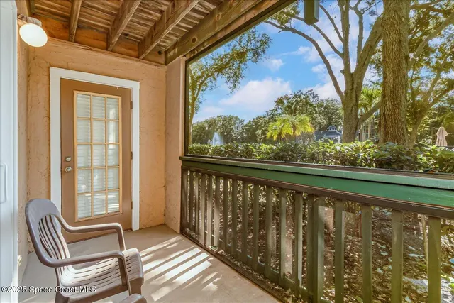 a view of balcony with furniture