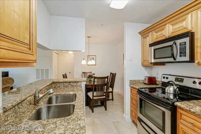 a kitchen with a stove and a sink
