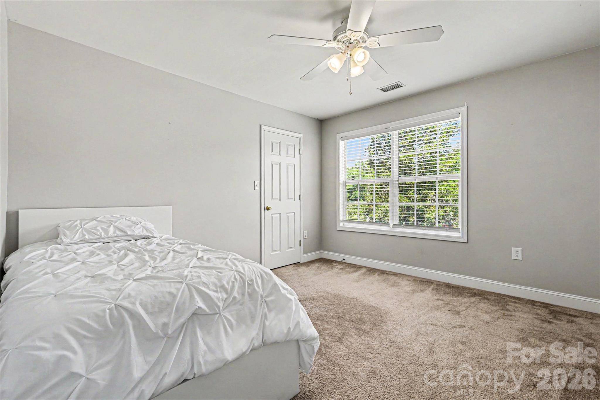 3035 Proverbs Court Monroe, NC 28110 - Photo 26 of 30 a large bed sitting in a spacious bedroom next to a window