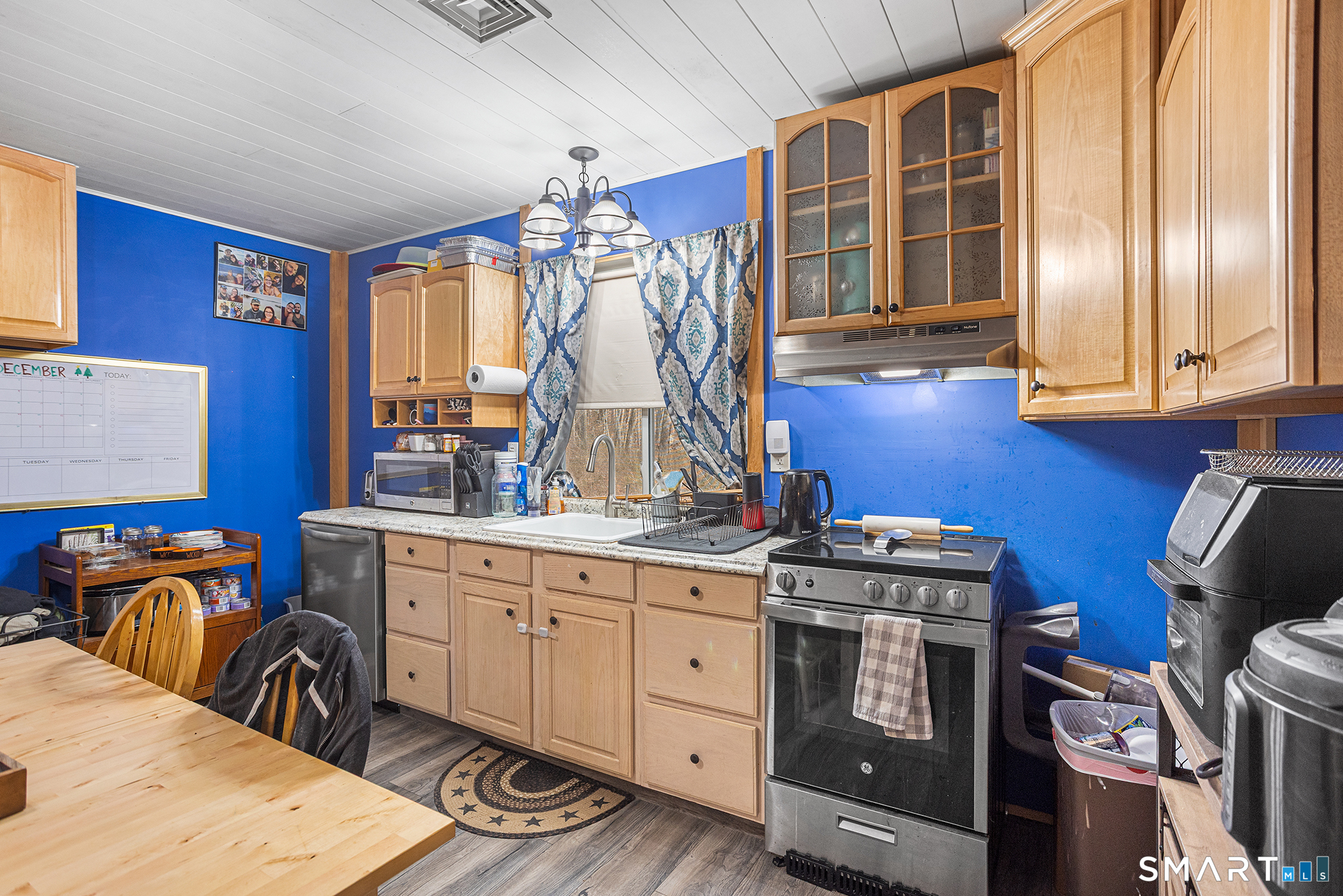 600 Woodtick Road Wolcott, CT 06716 - Photo 19 of 28 a kitchen with stainless steel appliances granite countertop a stove a sink and a cabinets