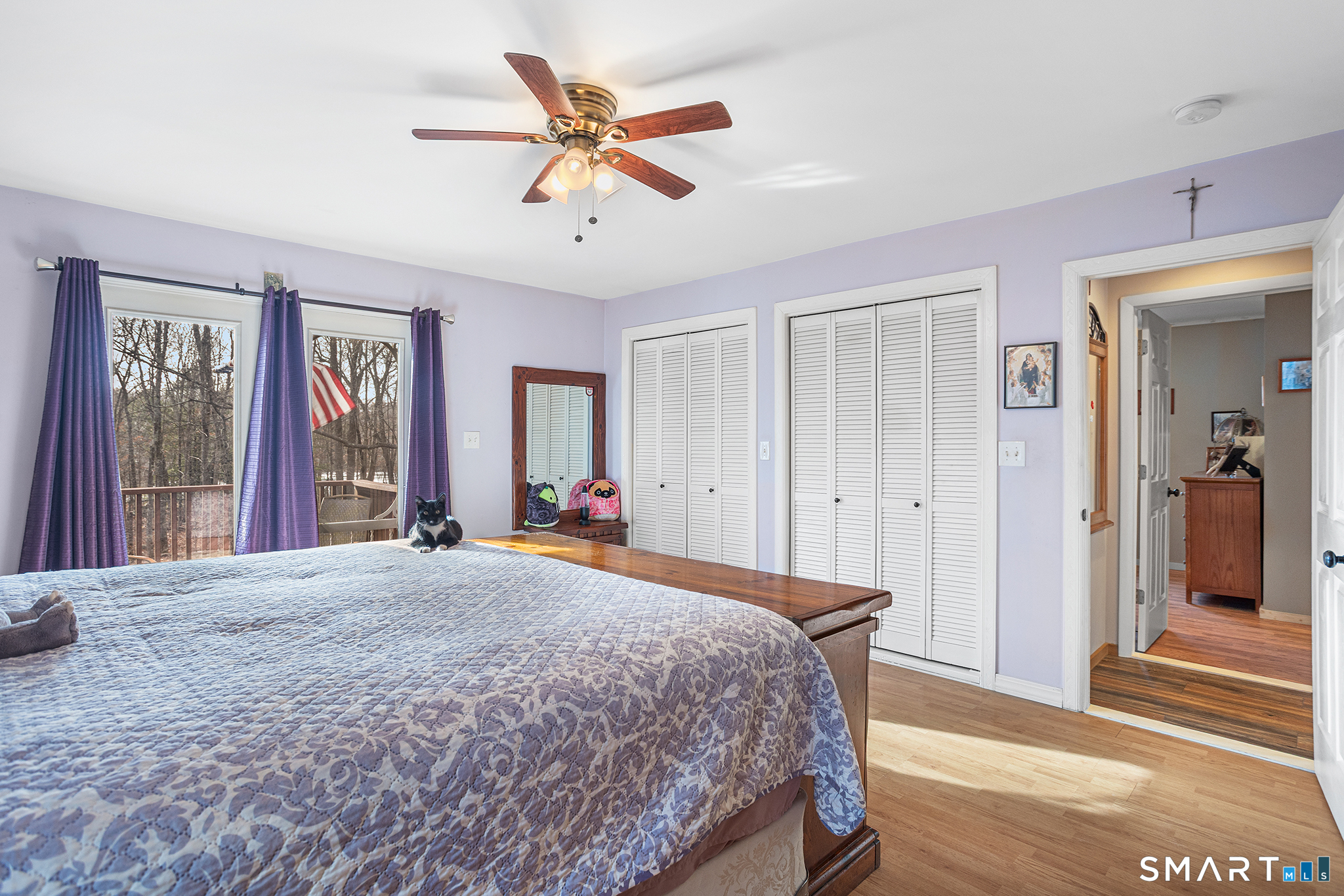 600 Woodtick Road Wolcott, CT 06716 - Photo 10 of 28 a bedroom with a bed and a chandelier