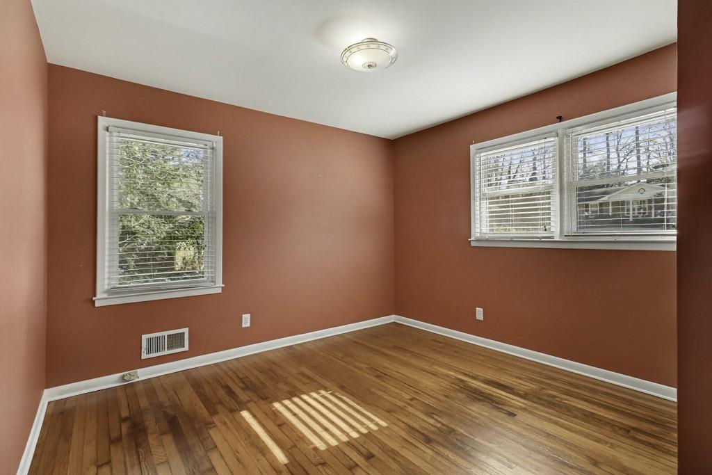 2524 Asbury Court Decatur, GA 30033 - Photo 15 of 26 a view of an empty room with wooden floor and a window