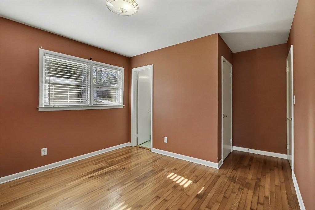 2524 Asbury Court Decatur, GA 30033 - Photo 16 of 26 a view of an empty room with wooden floor and a window