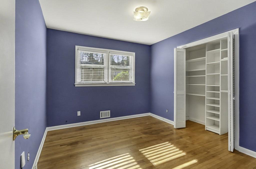 2524 Asbury Court Decatur, GA 30033 - Photo 18 of 26 a view of empty room with wooden floor and fan