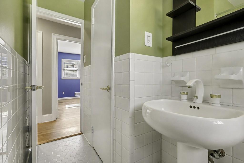 2524 Asbury Court Decatur, GA 30033 - Photo 19 of 26 a bathroom with a sink and a mirror