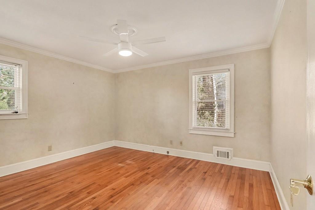 2524 Asbury Court Decatur, GA 30033 - Photo 22 of 26 an empty room with wooden floor and windows
