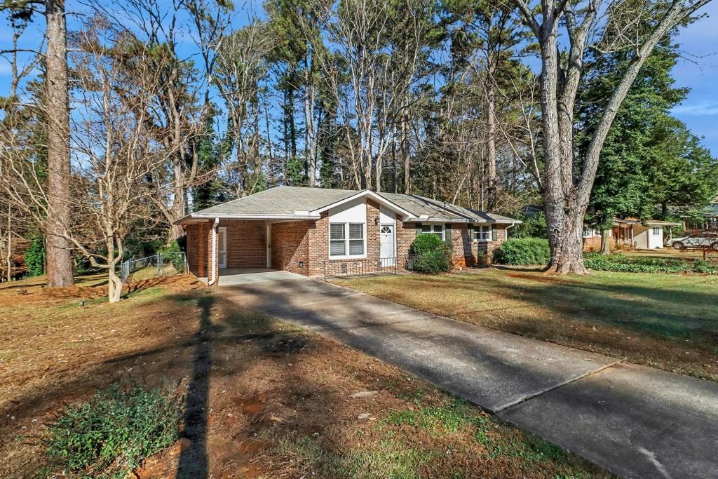 2524 Asbury Court Decatur, GA 30033 - Photo 6 of 26 a front view of a house with a garden